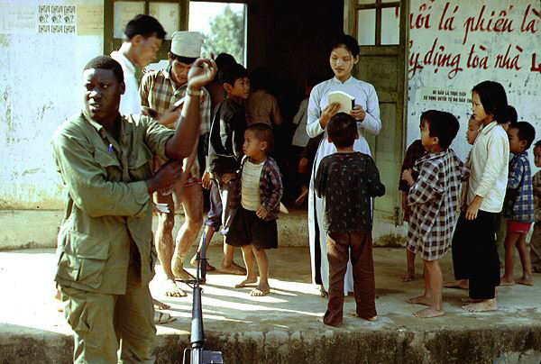 Note the rifle and bayonet next to "Jimmie."  We forced Saigon-approved textbooks on the teacher.